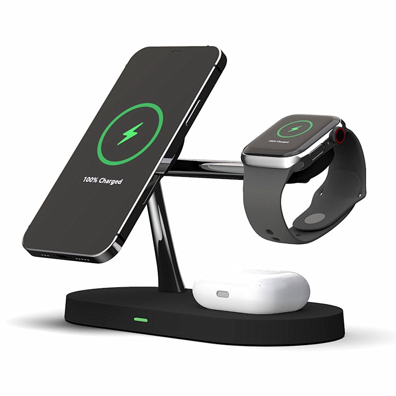 Fourfold Halo Dock in black charging a phone on its magnetic arm, an Apple Watch on its puck and earbuds on its base