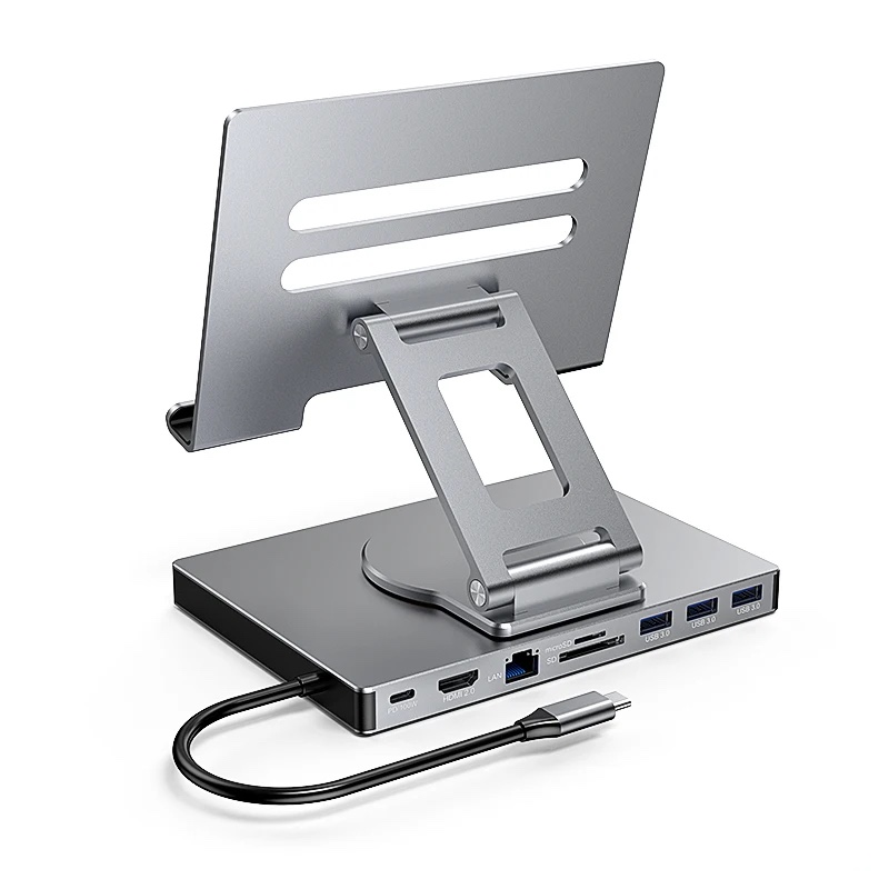 Fourfold 360 Tablet Stand & Hub, an aluminum tablet stand on a round turntable, its base lined with HDMI, network, card-reader and USB ports