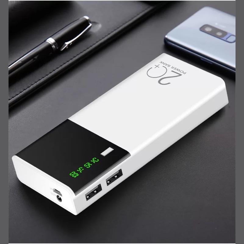 Fourfold Reserve power bank in white on a desk, its display and two USB ports at one end