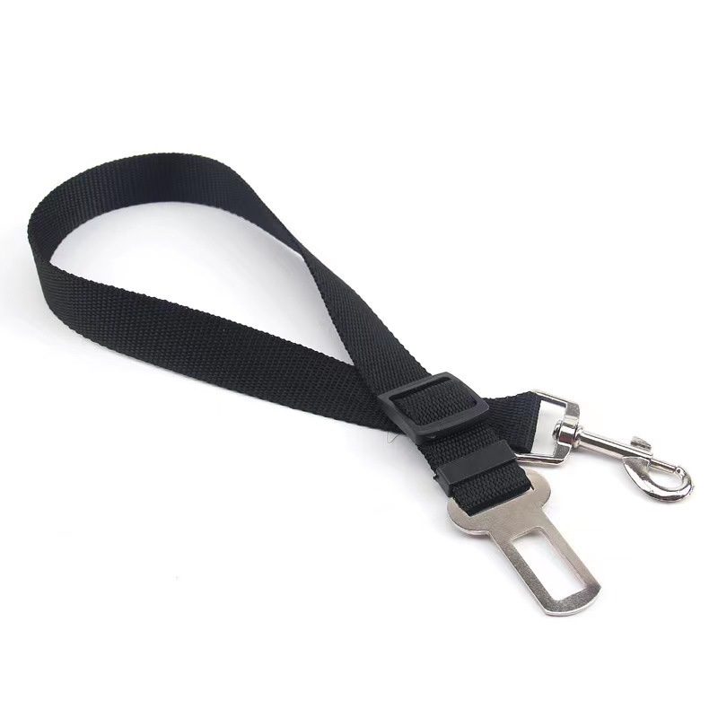Fourfold Tether dog seat belt in black: a webbing strap with a seat-belt tongue at one end and a snap hook at the other