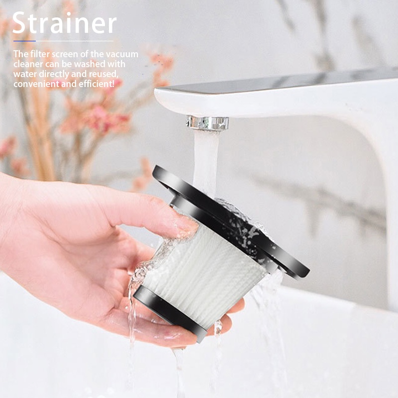 A hand rinsing the Fourfold Vortex's filter under a faucet